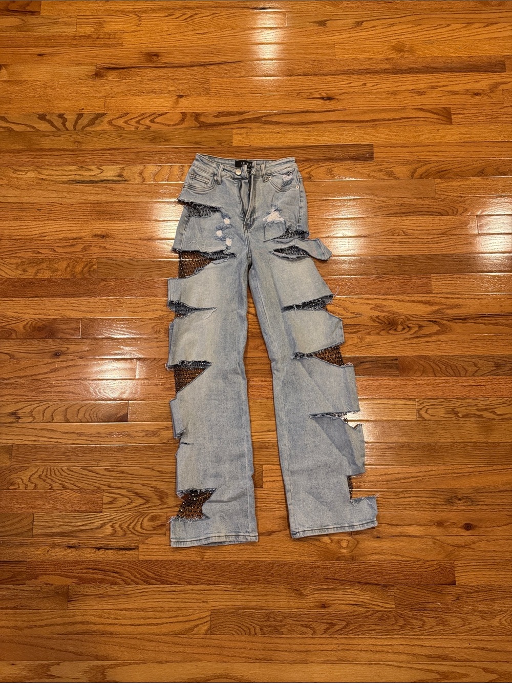 AKIRA Light Wash Flare Jeans with Sequin Cutouts